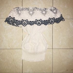 White blouse with blue and white lace